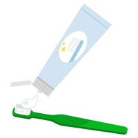緑の歯ブラシに歯磨き粉をつけるイラスト