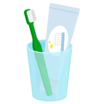コップに入った歯磨き粉と歯ブラシのイラスト（緑）