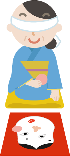 着物を着て福笑いをする中年の女性の