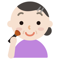 頬紅を塗る中年の女性